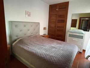 A bed or beds in a room at Casa Mila