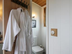 a bathroom with white towels hanging on a wall at The Heron in Cambridge +33 photos
