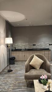 Posezení v ubytování الإقامة الذهبية للشقق المخدومة Golden Residence Hotel