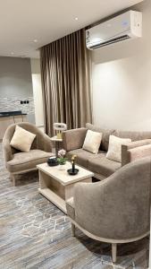 Posezení v ubytování الإقامة الذهبية للشقق المخدومة Golden Residence Hotel