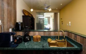 a kitchen counter with a sink and a mirror at St Luxo Copacabana Beach and Metro in Rio de Janeiro +38 photos