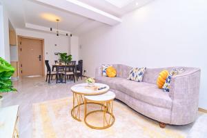 a living room with a couch and a table at Leshwa House 1 in Nairobi