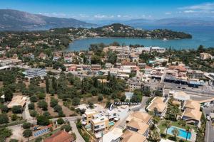 an aerial view of a city and a body of water at Villa Petra Gouvia by Villa Plus in Gouvia