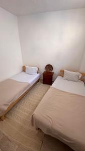 Postelja oz. postelje v sobi nastanitve Miramar GuestHouse