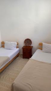 Postelja oz. postelje v sobi nastanitve Miramar GuestHouse