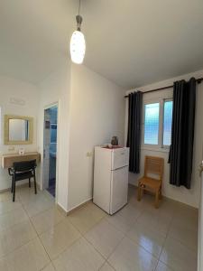 Kuchyň nebo kuchyňský kout v ubytování Hotel Mesun Himare