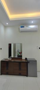 a counter in a room with a large mirror at Villa 6 in Ajman 