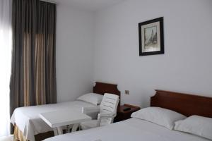 A bed or beds in a room at Kompleksi Jakaj