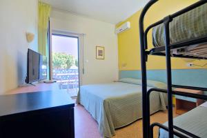 Ένα ή περισσότερα κρεβάτια σε δωμάτιο στο Hotel Roxy