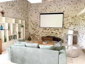 Χώρος καθιστικού στο Maison Pernette, cocon d'évasion avec bain nordique
