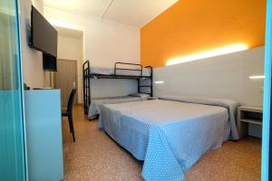 Ένα ή περισσότερα κρεβάτια σε δωμάτιο στο Hotel Roxy