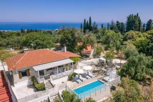 an aerial view of a house with a swimming pool at Villa Observer by Villa Plus in Kypseli