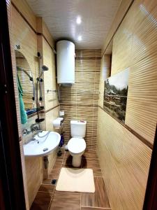 a bathroom with a toilet and a sink at Magi Sunrise in Balchik +30 photos