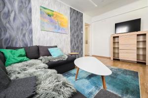 Televízia a/alebo spoločenská miestnosť v ubytovaní Centrum Charm Apartment