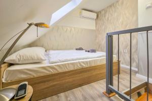 Posteľ alebo postele v izbe v ubytovaní Centrum Charm Apartment
