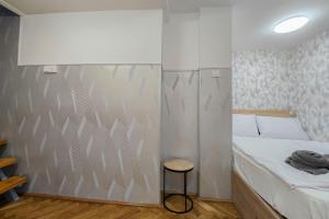 Posteľ alebo postele v izbe v ubytovaní Centrum Charm Apartment