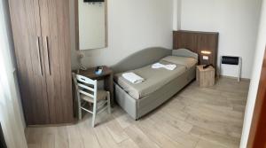 Postel nebo postele na pokoji v ubytování Hotel Bed and Book