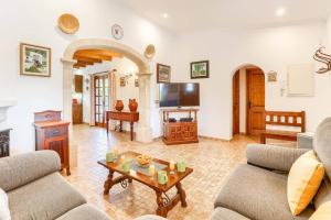 a living room with two couches and a coffee table at Villa Vinya Maria by Villa Plus in El Port