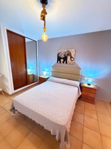 Postel nebo postele na pokoji v ubytování Corralejo Suite
