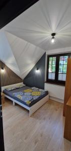 a bedroom with a bed in a room at Domek Nadmorski przy plaży Ustka in Ustka