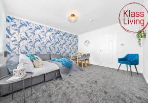 a living room with a couch and a table at West End House by Klass Living Bellshill in Bellshill