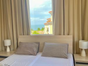 A bed or beds in a room at Apartments in complex ATIA RESORT