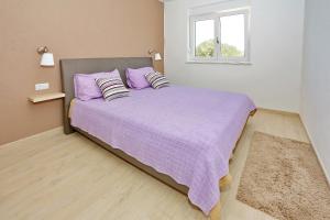 Postel nebo postele na pokoji v ubytování Apartments Šime