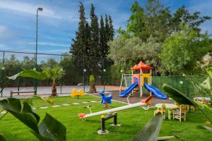a park with a playground with a slide at Marbel Hotel by PalmWings in Kusadası
