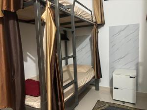 Postel nebo postele na pokoji v ubytování Sapthagiri Euphoria