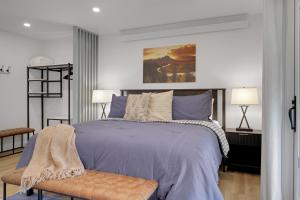 a bedroom with a large bed and two lamps at Spruces 11 in Wilson