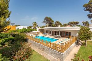 an aerial view of a house with a swimming pool at Villa Es Pins by Villa Plus in Son Carrio