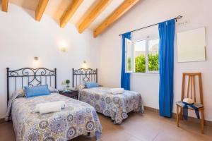Postel nebo postele na pokoji v ubytování Villa Gris by Villa Plus