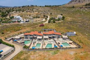 an aerial view of a house with a swimming pool at Villa Dione Seastone by Villa Plus in Kiotari