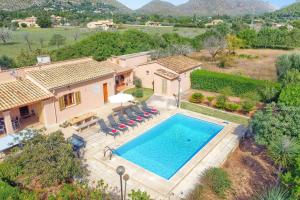 an aerial view of a house with a swimming pool at Villa Andreu by Villa Plus in El Port