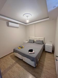 Ένα ή περισσότερα κρεβάτια σε δωμάτιο στο Saygan Apart +22 φωτογραφίες