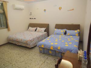 Postel nebo postele na pokoji v ubytování Sweetfishs Homestay