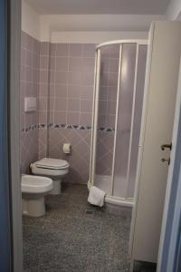 a bathroom with a toilet and a shower at Il Casaletto in Palombara Sabina