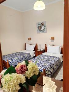 Postel nebo postele na pokoji v ubytování Hotel Anagennisis