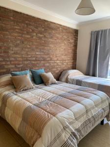 Ein Bett oder Betten in einem Zimmer der Unterkunft Complejo Pampa