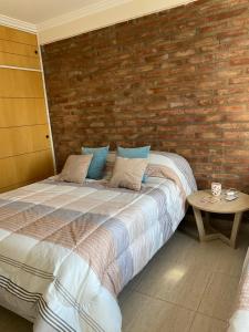 Ein Bett oder Betten in einem Zimmer der Unterkunft Complejo Pampa