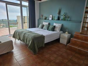 Postel nebo postele na pokoji v ubytování La Roqueta Hotel