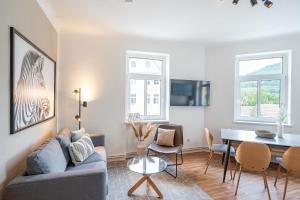 Et tv og/eller underholdning på Benville Freital - 2 Schlafzimmer - Wohnküche - WLAN