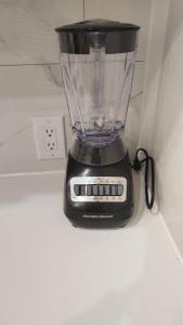 a blender sitting on top of a counter at Central Toronto Economical Stay-Stress Free Checkin in Toronto