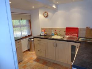 a kitchen with a sink and a counter at Ballacowell Cottage in Sulby