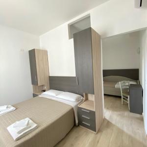 Postel nebo postele na pokoji v ubytování Hotel Bed and Book