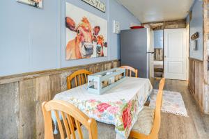 a room with a table and chairs and a refrigerator at Walk to Lake Buchanan Cottage Near Wineries! in Buchanan Dam