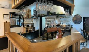 a bar in a restaurant with a counter at Lo Tira Cap in Lahourcade