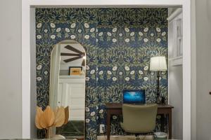 a room with a mirror and a desk with a chair at Timeless Charm by the Coast, Vintage Beach Bungalow in Long Beach