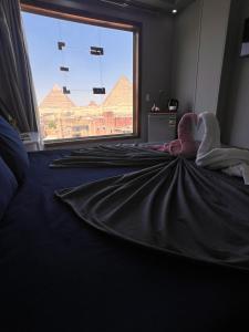 Postel nebo postele na pokoji v ubytování Egypt pYramids Hotel
