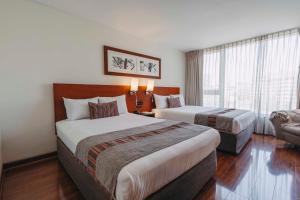 A bed or beds in a room at Time Select - Elegant Apartments